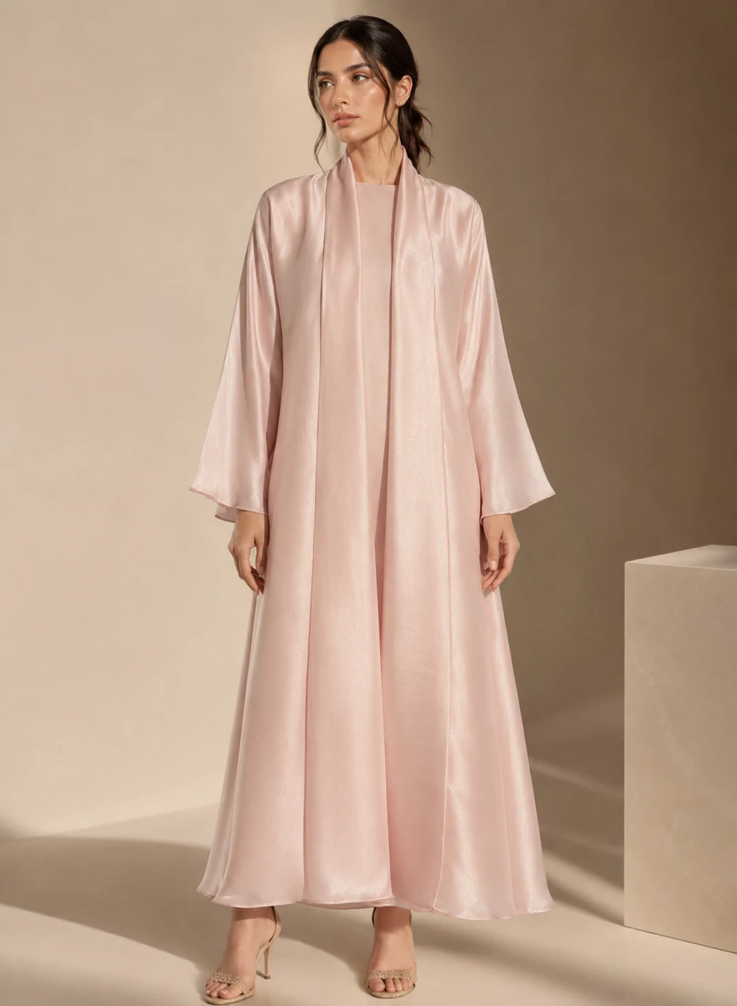 Open abaya, front view, worn over the matching inner dress.
