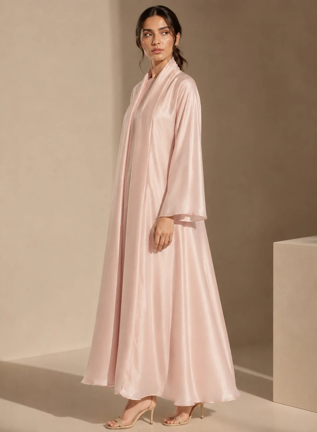 A blush satin open abaya set from our range, worn over a matching inner dress