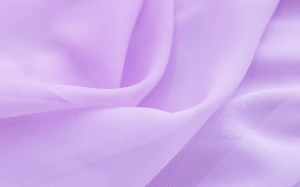 Illustrative: sheer chiffon, the light drape used for occasion abayas. Licensed stock photograph, not our own roll.