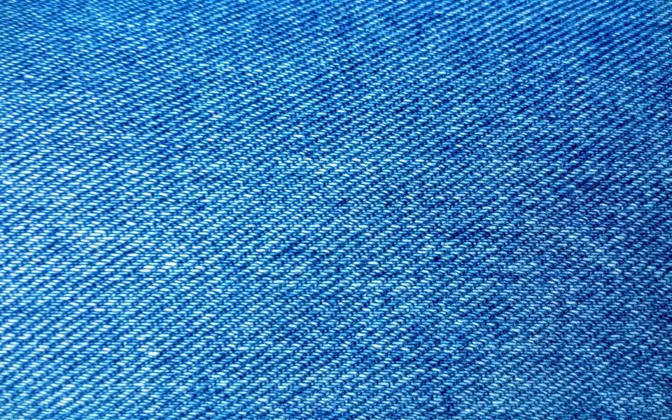 Close-up of blue denim showing the diagonal twill weave