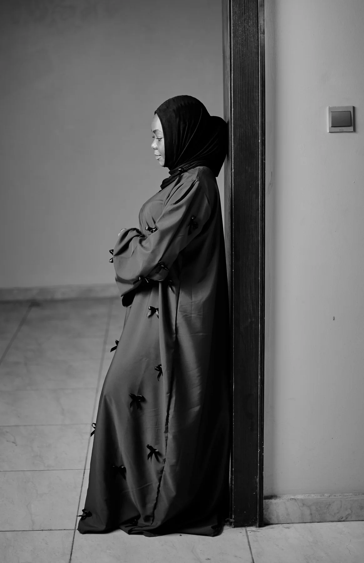 Illustrative: a simple black abaya. Licensed stock photograph, not our own product.
