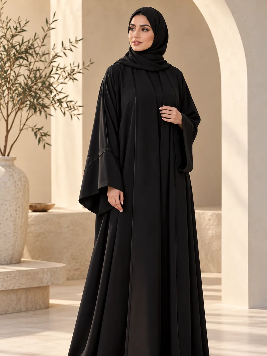 Black nida abaya with wide flared sleeves and a matching hijab, from a wholesale abaya manufacturer in Dubai