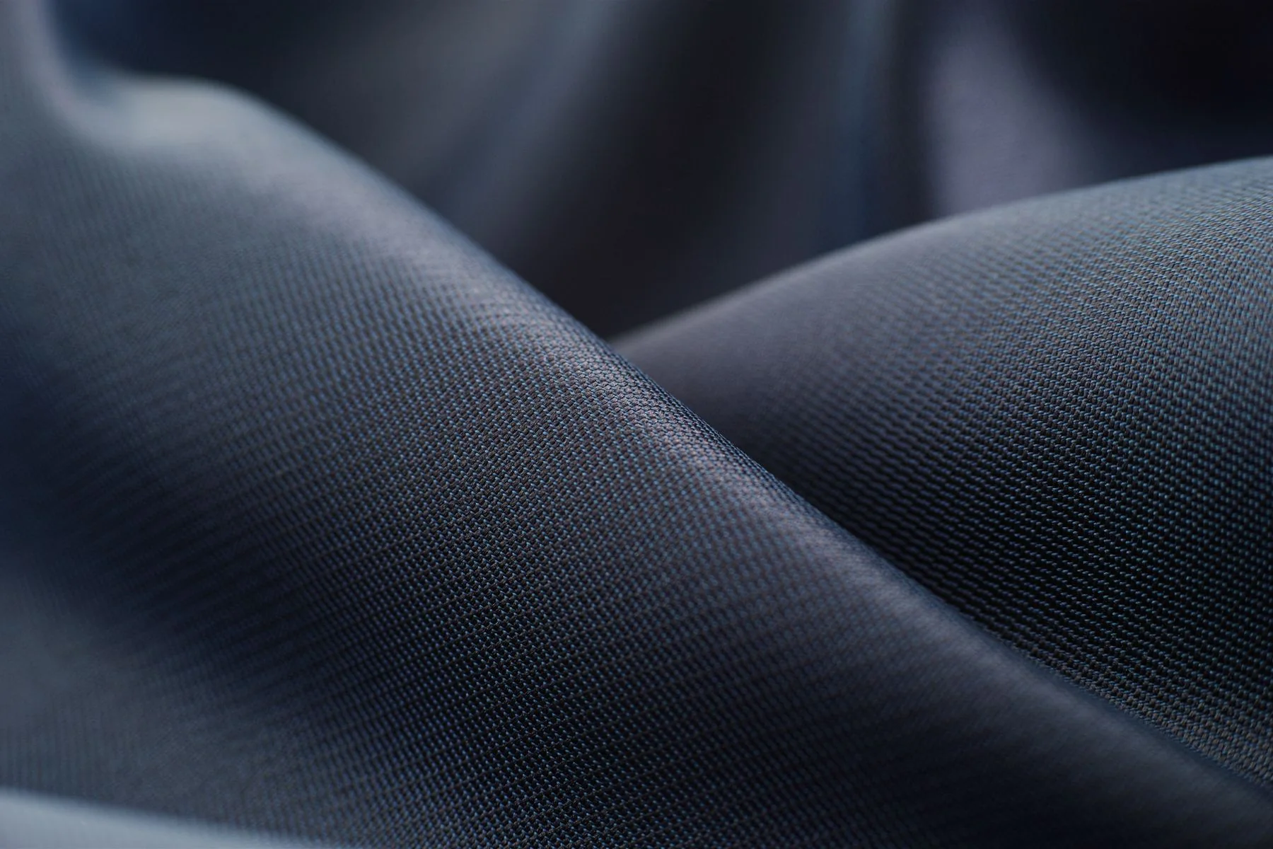 Illustrative: folds of satin fabric. Licensed stock photograph, not our own product.
