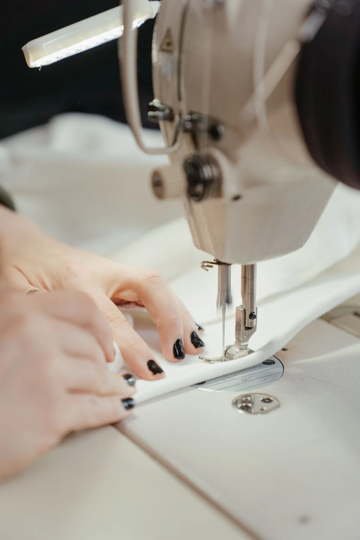 Illustrative: a stitch line being sewn. Licensed stock photograph, not taken during our production.